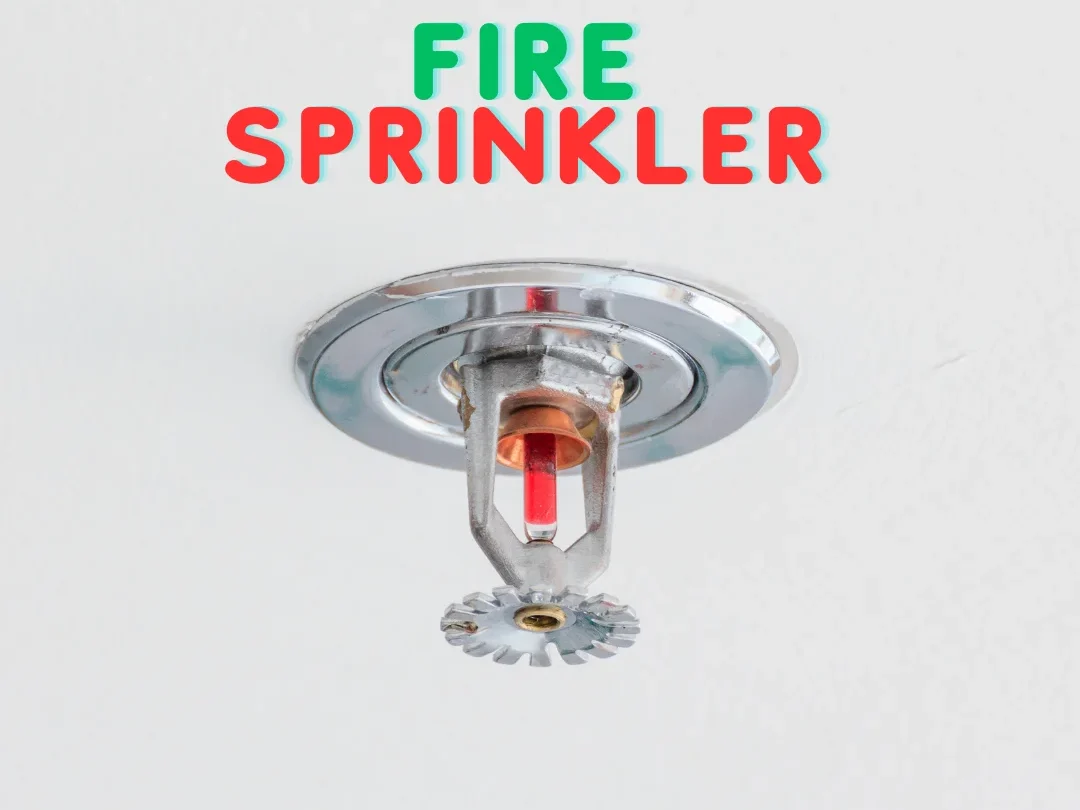 A Fire Sprinkler installed on ceiling level with the Help of Plate on a white colored Roof, Fire Bazaar also mentioned on it.